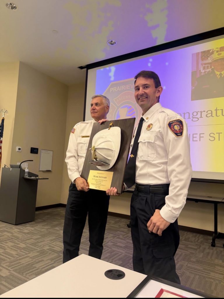 Fire Chief Mark Stewart being recognized for his 45 years of service at his retirement celebration.